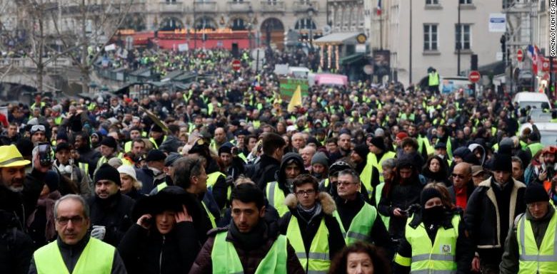 French police investigate reports of decorated officer filmed punching protesters