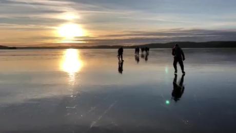 Ice skaters capture a frozen lake ‘singing’