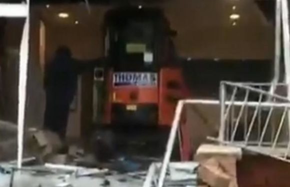 A digger driver has been filmed smashing up a new hotel in Liverpool on the day it was due to be completed – allegedly because he had not been paid.