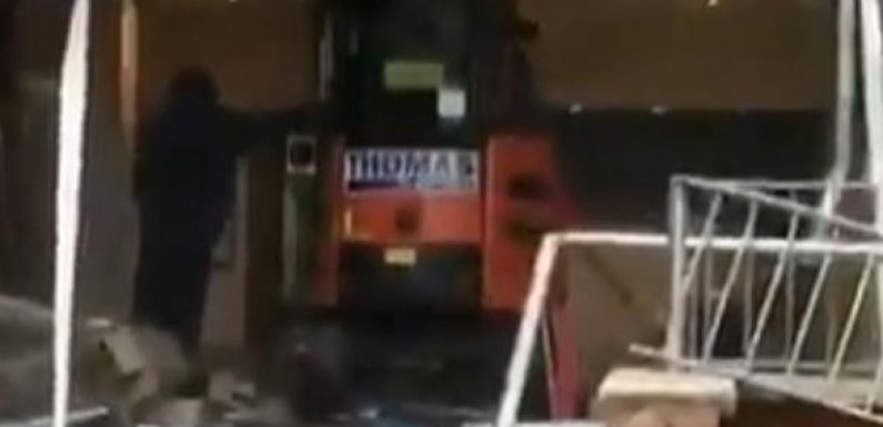 A digger driver has been filmed smashing up a new hotel in Liverpool on the day it was due to be completed – allegedly because he had not been paid.