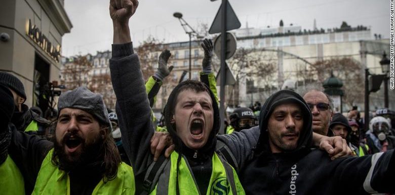Police clash with demonstrators in Paris as yellow vest protesters join climate change march