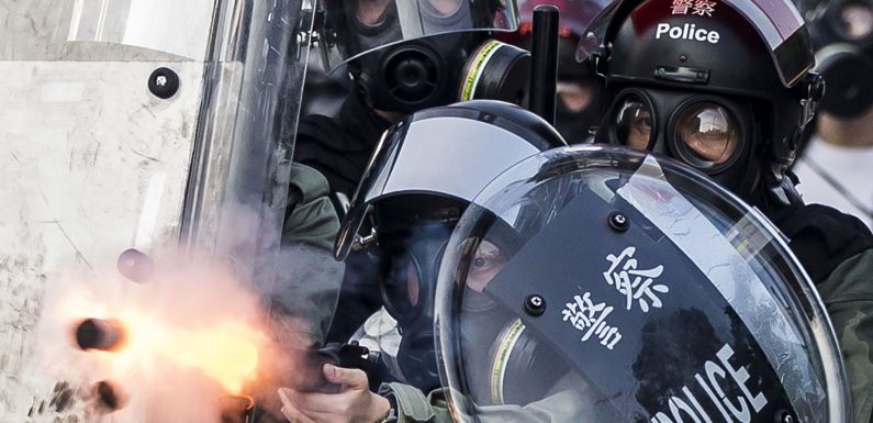 Hong Kong protests: Shot teenager charged with rioting and attacking police