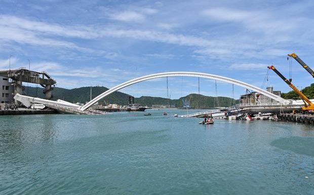 Bridge collapse in Taiwan sends oil tanker truck tumbling onto boats in fishing harbor