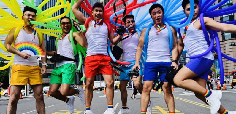 Tens of thousands take to the streets as Taiwan holds first Pride parade since legalising same-sex marriage