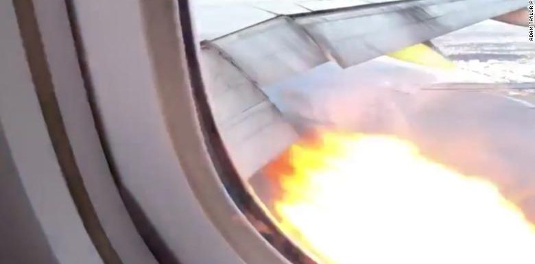 A Boeing 777 lands safely back in Los Angeles after flames shoot from an engine