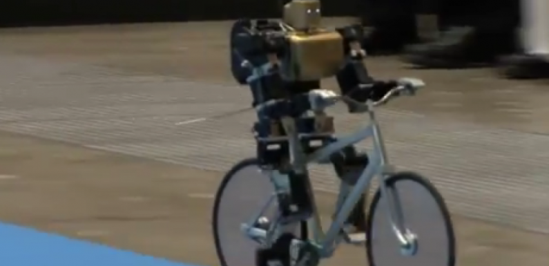Miniature robot rides bicycle like a pro